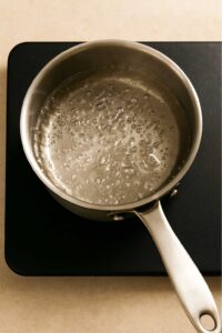 Water boiling in saucepan for Costa Rican tea recipe
