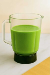 Blended Detox Island Green Smoothie in a glass blender